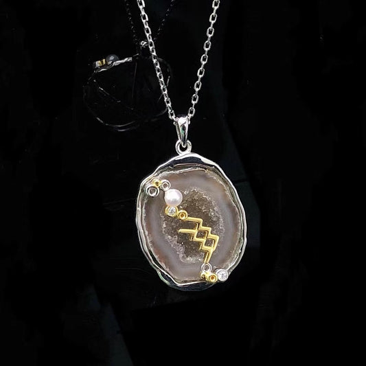 Aquarius crystal geode zodiac pendant with Aquarius symbol, front view