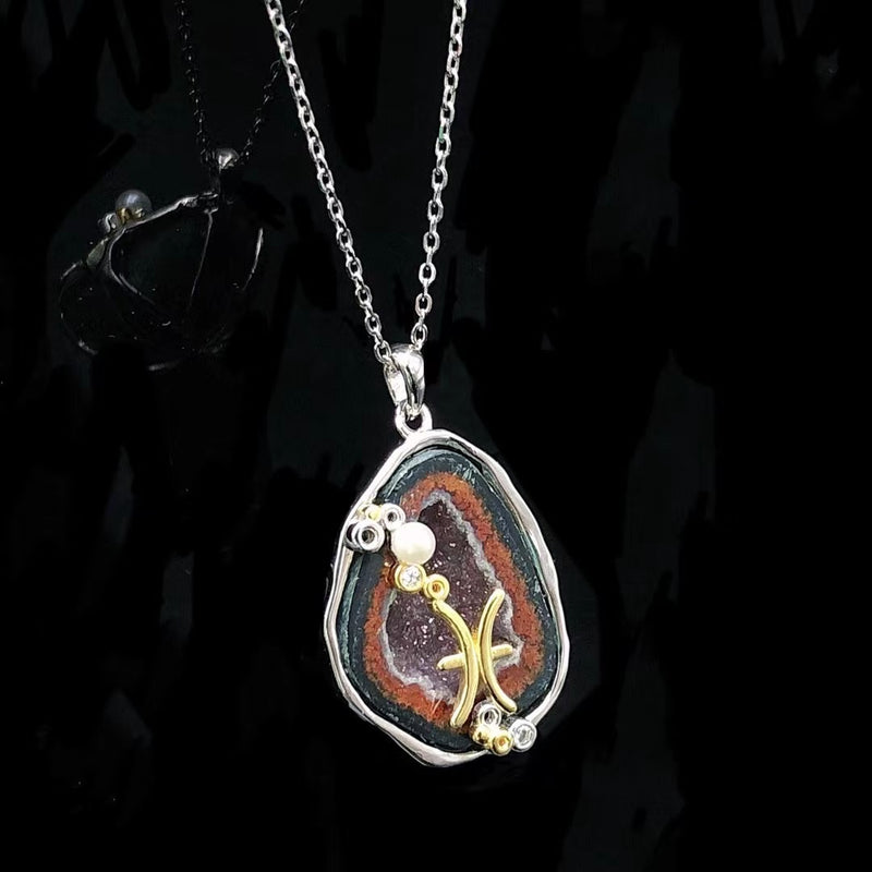 Pisces crystal geode zodiac pendant with Pisces symbol, angled view