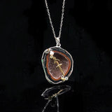 Sagittarius crystal geode zodiac pendant with Sagittarius symbol, front view