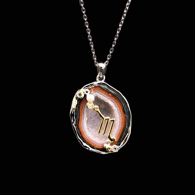Scorpio crystal geode zodiac pendant with Scorpio symbol, front view