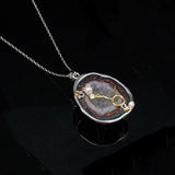 Taurus crystal geode zodiac pendant with Taurus symbol, angled view