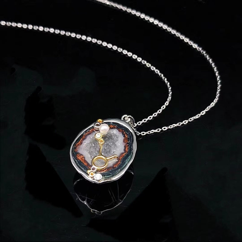 Taurus crystal geode zodiac pendant with Taurus symbol, angled view